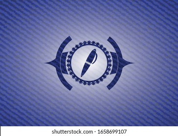 pen icon inside badge with denim texture