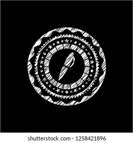 pen icon inside chalk emblem