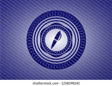 pen icon inside emblem with jean texture