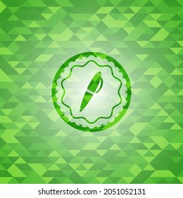 pen icon inside green mosaic emblem. 