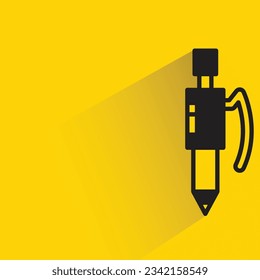 pen with shadow on yellow background