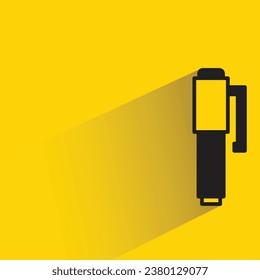 pen with shadow on yellow background