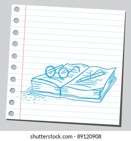 Pencil and glasses on a book