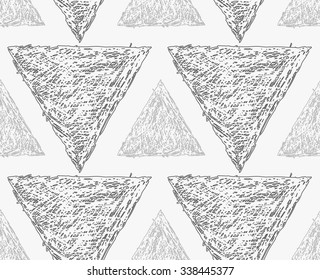 Pencil hatched light and dark gray triangles.Hand drawn with brush seamless background.Modern hipster style design.