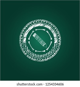 pencil icon inside chalkboard emblem written on a blackboard