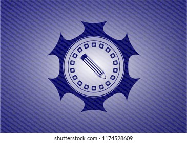 pencil icon inside emblem with denim texture