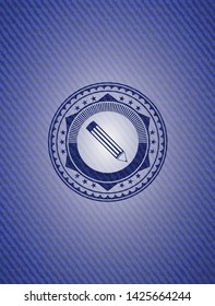 pencil icon inside emblem with jean background