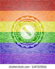 pencil icon inside emblem on mosaic background with the colors of the LGBT flag