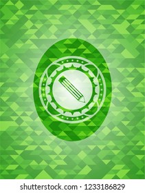 pencil icon inside green emblem. Mosaic background