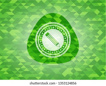 pencil icon inside green emblem with mosaic background