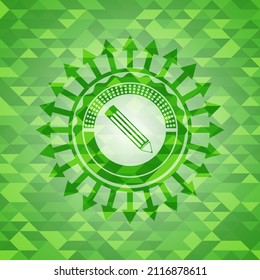 pencil icon inside green emblem with triangle mosaic background. 
