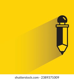 pencil with shadow on yellow background