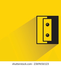 pencil sharpener with shadow on yellow background