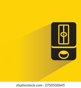 pencil sharpener with shadow on yellow background