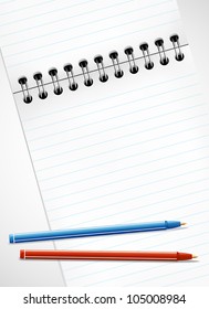 Pencils and blank page of a notebook for your message
