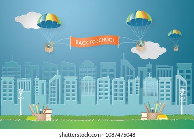 PENCILS,RULER,ERASER in the wooden basket and tied with white rope parachute from the sky coming to the city.Back to school education concept ,vector and illustration.