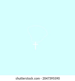 Pendant cross on a clear sky background