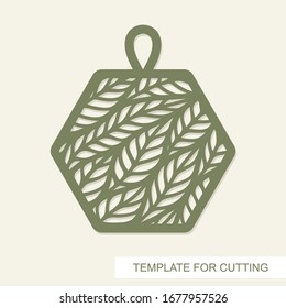 Pendant in the shape of hexagon with leaves inside. Openwork template for laser cutting, metal engraving, wood carving, plywood, cardboard, paper cut or printing. Floral pattern. Vector illustration.