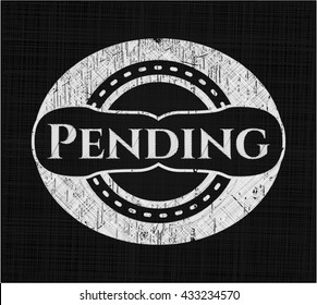 Pending chalkboard emblem on black board