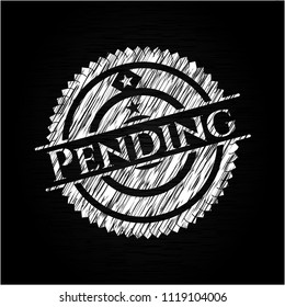 Pending chalkboard emblem written on a blackboard