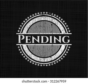 Pending chalkboard emblem written on a blackboard