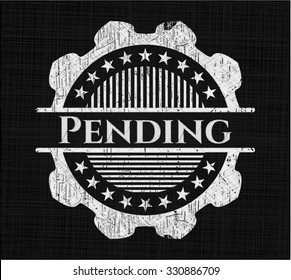 Pending chalkboard emblem written on a blackboard