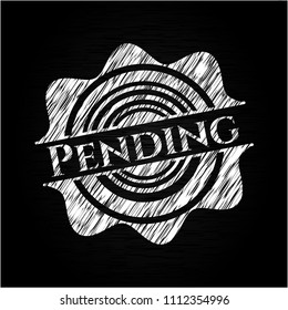  Pending written on a blackboard