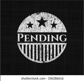 Pending written on a chalkboard