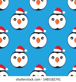 Penguin seamless pattern. Cute penguins isolated pattern on blue with white snow background.