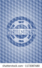Penitentiary blue emblem with geometric pattern.