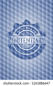 Penitentiary blue emblem with geometric pattern.