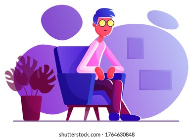 A pensive young man in glasses sitting in a chair. Near the armchair is a monsterra in a pot.