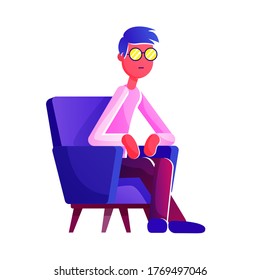 A pensive young man in glasses sitting in a chair.