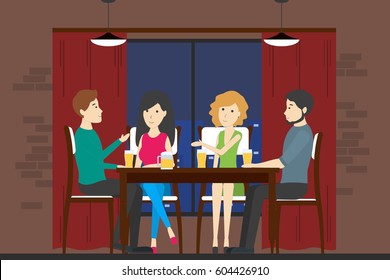 People in bar. Company of men and women sit on the table and drink alcohol and have fun.