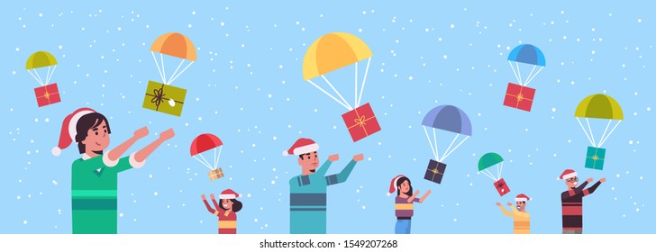 people catching gift present boxes falling down with parachutes merry christmas happy new year holiday celebration concept men women wearing santa hats horizontal portrait vector illustration
