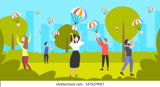 People catching parcel boxes falling down with parachute from the sky. Shipping package delivery concept. 