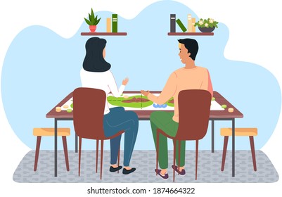 People communicating and spending time together. Girl and guy are playing who I am. A couple is sitting at a table and playing a board game at home. People in a relationship have fun in the apartment