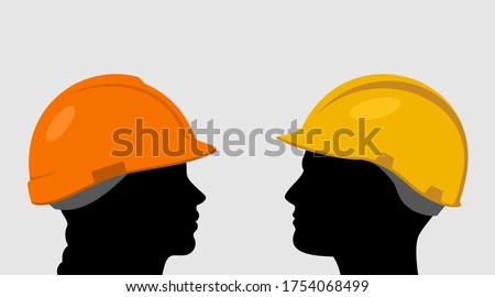 People in construction helmets icon