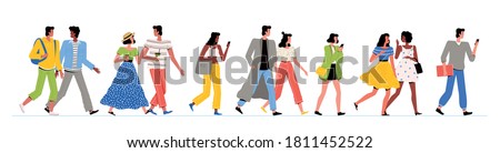 People of different nationalities in fashionable clothes are walking. Men and women walk, chat and look at their phones. Walking, friendship and communication concept