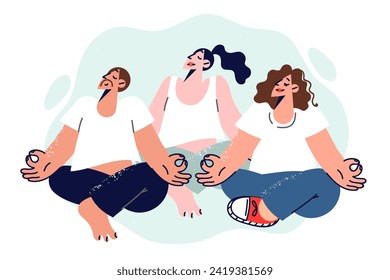 People do yoga or meditation, sitting in lotus position and practicing buddhist teachings, to achieve balance in life. Man and woman located together in studio for yoga to improve mood