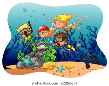 Personas haciendo buceo bajo el océano