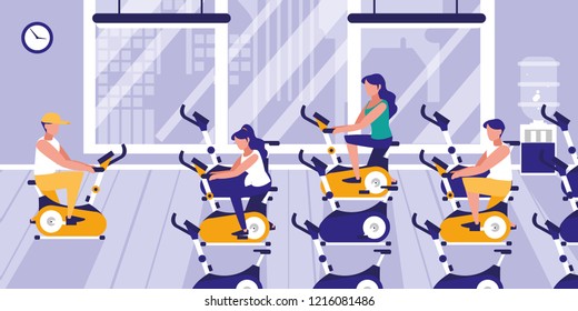 people doing spinning in gym