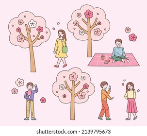 People are enjoying leisure in the cherry blossom park. flat design style vector illustration.