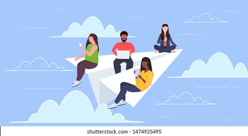 people flying on paper airplane mix race men women using gadgets traveling together digital addiction web surfing concept horizontal flat