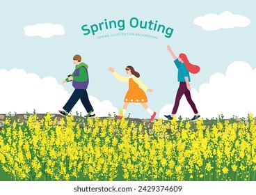 People going on a spring picnic through a field of yellow rape flowers on a spring day