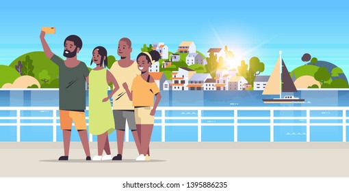 people group taking selfie photo on smartphone camera african american friends standing together mountain city island landscape background holiday travel concept full length horizontal