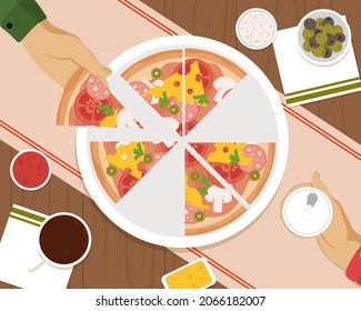 People having dinner together and sharing a huge pizza with drinks, hands top view. Friends dinner with pizza.