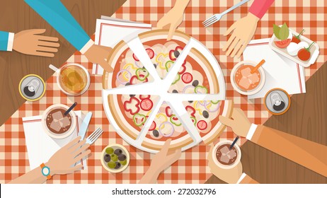 People having dinner together and sharing a huge pizza with drinks, hands top view