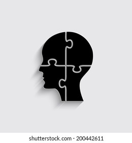 People head with puzzles elements on a grey background
