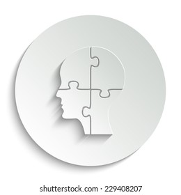  People head with puzzles elements - vector icon with shadow on a round button